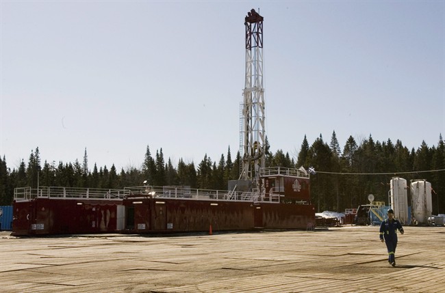 A gas worker walks from a shale gas drilling rig, on March 25, 2009 in Saint-Edouard-de-Lotbiniere Que.
