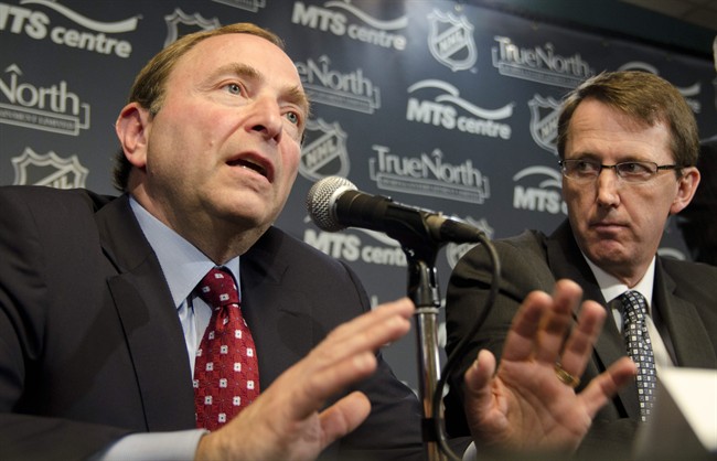 True North Sports and Entertainment Limited chairman Mark Chipman (right) looks on as NHL commissioner Gary Bettman speaks at a press conference in Winnipeg, Tuesday, May 31, 2011, announcing an NHL franchise returning to the city of Winnipeg.