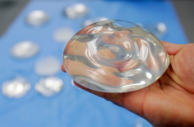 In this Dec. 11, 2001 file photo, a silicone gel breast implant is shown at Mentor Corp. manufacturing facility in Irving, Texas.