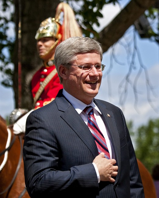 Prime Minister Stephen Harper, arrives at Spruce Meadows in Calgary, Alta., Saturday, July 9, 2011. Harper, his wife Laureen, and daughter Rachel, are taking in an equestrian event with Gov. Gen. David Johnson and his wife Sharon. THE CANADIAN PRESS/Jeff McIntosh.