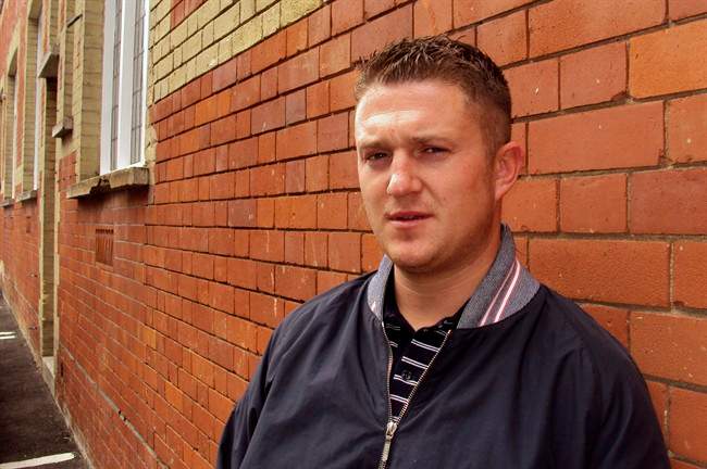 Stephen Lennon, 28, leader of the English Defense League, poses for a photograph following an interview with The Associated Press in Luton, approximately 27 miles (43 kilometers) from London, Tuesday, July 26, 2011. Lennon, leader of the English Defense League, told The Associated Press on Tuesday that he does not condone Breivik's rampage but "the fact that so many people are scared - people have to listen to that." (AP Photo/Paisley Dodds).