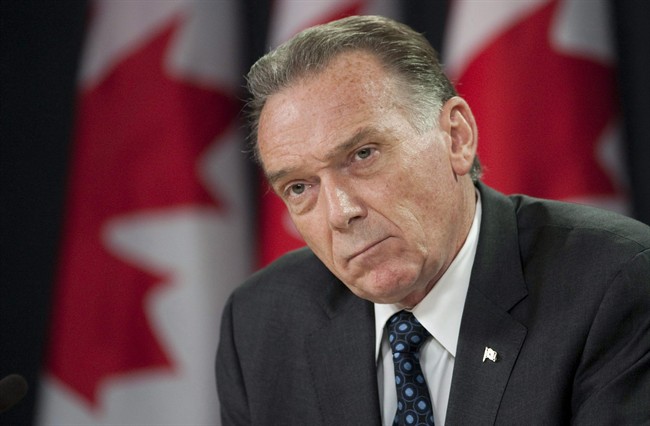 Minister of the Environment Peter Kent during a news conference in Ottawa, Thursday July 21, 2011. THE CANADIAN PRESS/Adrian Wyld.