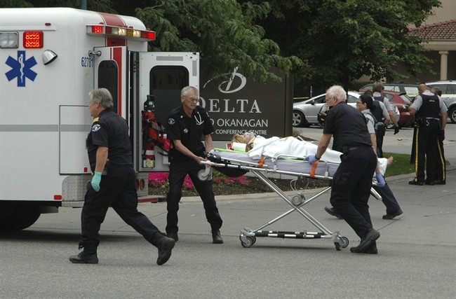 Paramedics take one of several victims of a shooting outside of the Delta Grand hotel in downtown Kelowna, B.C., to hospital on Sunday, April 14, 2011. THE CANADIAN PRESS/The Daily Courier- J.P. Squire.
