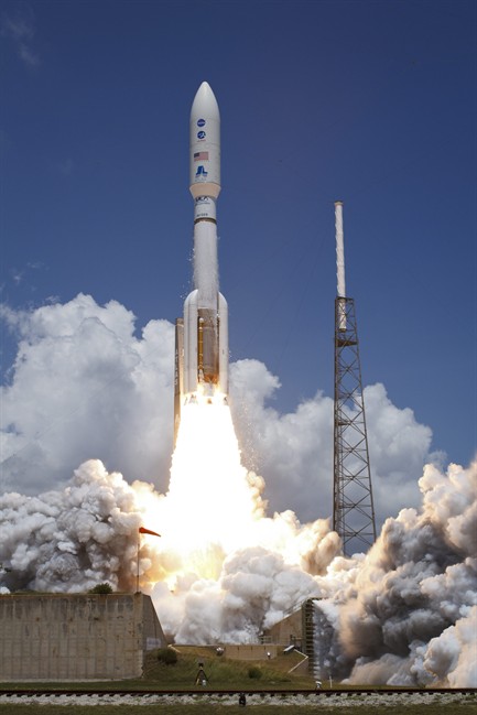 An Atlas V rocket launches with the Juno spacecraft payload from Space Launch Complex 41 in Cape Canaveral, Fla. on Friday, Aug. 5, 2011. The sun-powered robotic explorer is heading toward Jupiter on a fresh quest to discover the secret recipe for making planets. (AP Photo/NASA, Bill Ingalls).