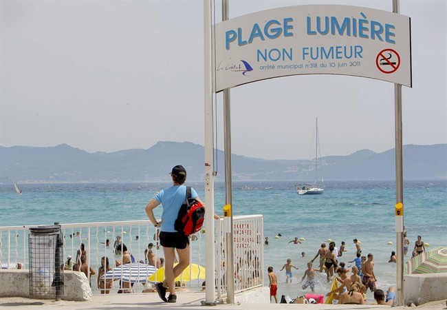 In this file photo, French tourists are seen at La Ciotat beach near Marseille, southern France. (AP Photo/Jacques Brinon).