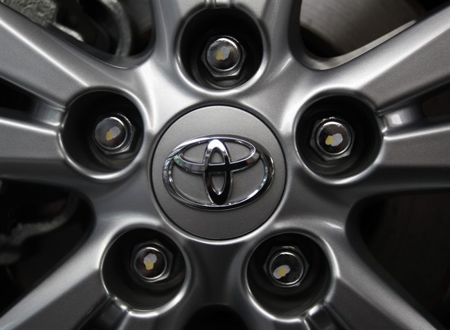 Toyota Motor Corp. recalled 340,000 gas-electric hybrid Prius cars around the world Wednesday for a defect in their parking brakes.