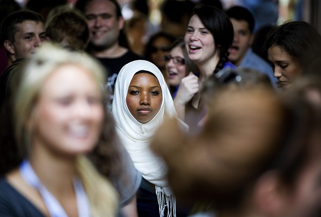Gilary Massa, 26, stands at the Ryerson University Campus where she works for the Students Union in Toronto on Thursday September 1, 2011. Gilary has had to deal with defending and explaining her faith since the September 11 attacks in 2001. THE CANADIAN PRESS/Aaron Vincent Elkaim.
