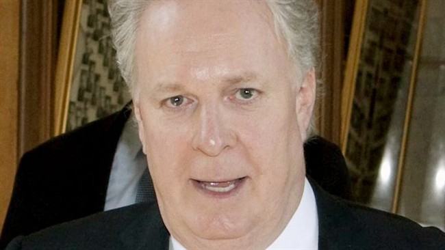 Quebec Premier Jean Charest walks on June 7, 2011 at the legislature in Quebec City. THE CANADIAN PRESS/Jacques Boissinot.