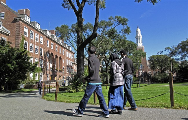 In this Friday, Oct. 7, 2011 photo, people walk on the campus of Brooklyn College in the Brooklyn borough of New York. Investigators have been infiltrating Muslim student groups at Brooklyn College and other schools in the city, monitoring their Internet activity and placing undercover agents in their ranks, police documents obtained by The Associated Press show. Legal experts say the operation may have broken a 19-year-old pact with the colleges and violated U.S. privacy laws, jeopardizing millions of dollars in federal research money and student aid. (AP Photo/Bebeto Matthews).