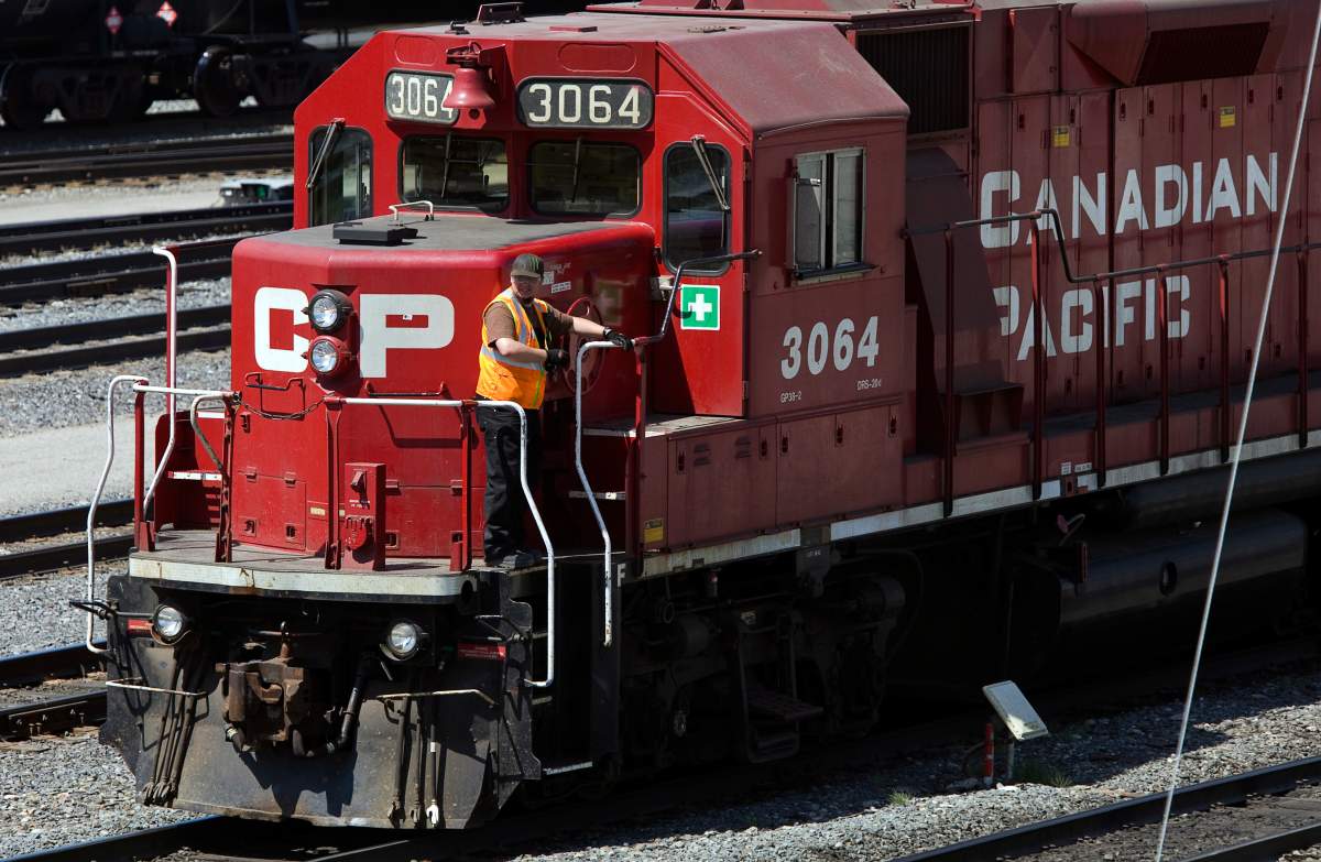 A CP Rail train travels down the tracks. 