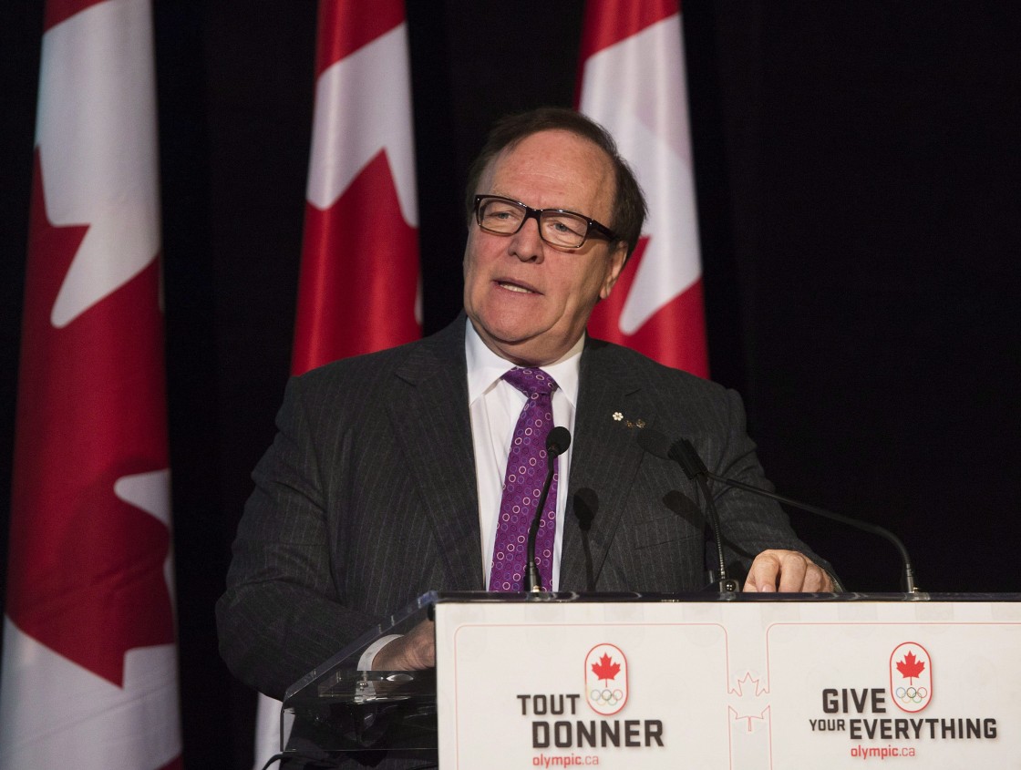 Marcel Aubut, President of the Canadian Olympic Committee speaks as he gets ready to hand out the Queen Elizabeth ll Diamond Jubilee medals to Olympic athletes, coaches and builders in Toronto on Thursday, April 11, 2013.