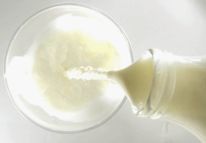 This illustration shows milk being poured in to a glass on December 10, 2003 in London.