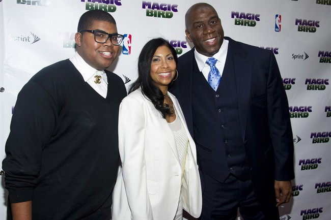 This April 11, 2012 file photo shows Magic Johnson, right, his wife Cookie and son E.J. arriving for the opening night performance of the Broadway play \”Magic/Bird\” in New York.