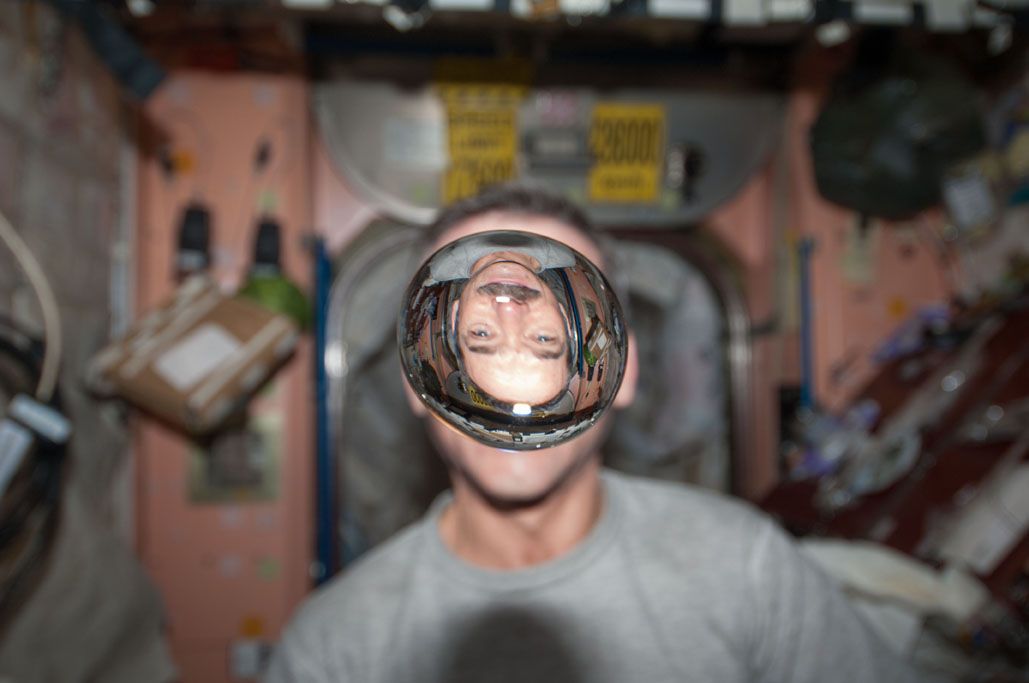 Chris Hadfield aboard the International Space Station, an orbiting science platform that has been in space 16 years.
