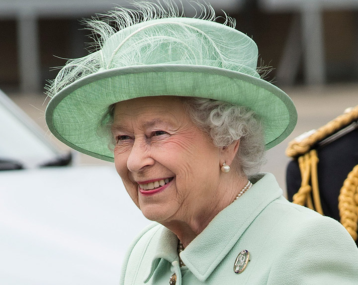 Queen Elizabeth II is greeted on her arrival during a visit to The King’s Troop Royal Horse Artillery unit at Woolwich Barracks on May 31, 2013 in Woolwich, England. (Photo credit: AP Photo)