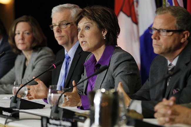 Alberta Premier Alison Redford, (left to right) Manitoba Premier Greg Selinger and Saskatchewan Premier Brad Wall listen in as British Columbia Premier Christy Clark responds to media questions during the press conference for the 2013 Western Premier's Conference in Winnipeg, Monday, June 17, 2013. 