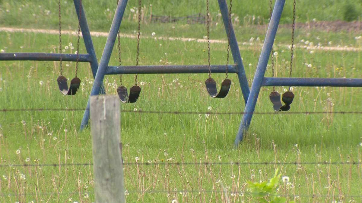 A swing set sits idle after children were seized from a small Old Order Mennonite community 