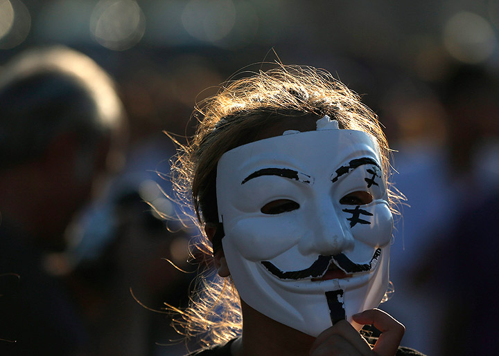 A young woman stands in a silent protest at Taksim Square in, Istanbul, Turkey, Tuesday, June 18, 2013. 