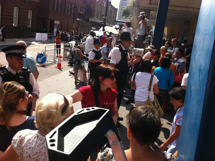 Police are continually having to shoo away gawkers from the door of the Lindo Wing at Saint Mary’s hospital so patients can access the hospital. July 22, 2013. (Photo credit: Sean Mallen, Global News)