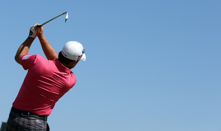 Northern Ireland’s Graeme McDowell plays the 16th tee during the second round of the 2013 British Open Golf Championship at Muirfield golf course at Gullane in Scotland on July 19, 2013 . (Photo credit: ADRIAN DENNIS/AFP/Getty Images)