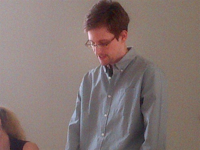 This image provided by Human Rights Watch shows NSA leaker, Edward Snowden looking down during a press conference at Moscow's Sheremetyevo Airport, Friday, July 12, 2013. 