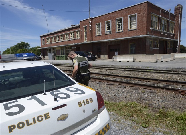 Surete du Quebec investigators work at the Montreal, Maine and Atlantic Railway Inc. office in Farnham, Que., on Thursday, July 25, 2013.