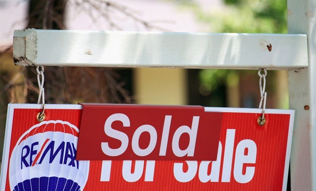 A house "sold" sign in Oakville, Ont., on July 23, 2012.