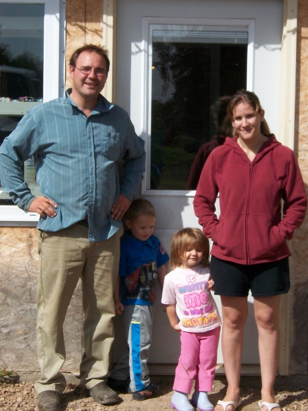 Alain and Karla Labrecque with their children Alec and Kandace, in front of their old farmhouse near Reno, Alberta in 2011. Photo courtesy of Karla Labrecque.