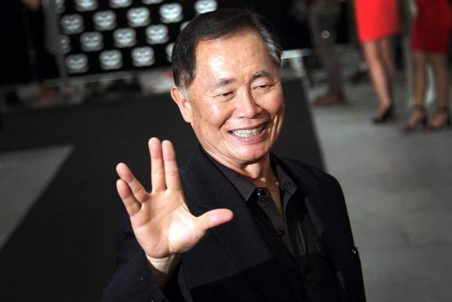 This May 23, 2013 file photo shows actor George Takei gesturing with a hand greeting made popular by the TV series "Star Trek" at the Marina Bay Sands hotel in Singapore.