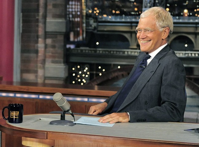 In this July 16, 2013 file photo, host David Letterman smiles on the set of the “Late Show with David Letterman.”