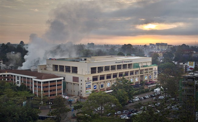 Dawn breaks over the still-smoldering Westgate Mall in Nairobi, Kenya, Thursday, Sept. 26, 2013.