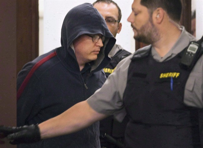 Jeffrey Paul Delisle leaves court in Halifax on Oct. 10, 2012.
