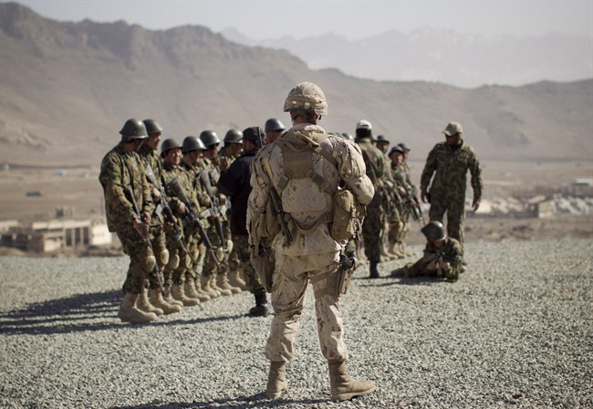 A Canadian soldier mentors a training session of Afghan National Army soldiers in 2012 at the Kabul Military Training Center in Afghanistan.