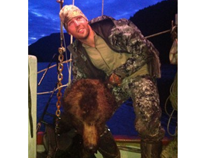 Clayton Stoner has confirmed he is the person holding up the head of the grizzly bear in this photo.