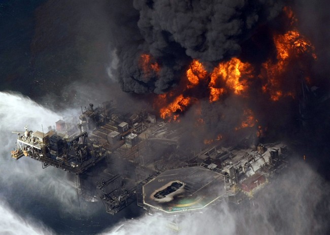 In an April 21, 2010 file photo, the Deepwater Horizon oil rig burns after a deadly explosion in the Gulf of Mexico.