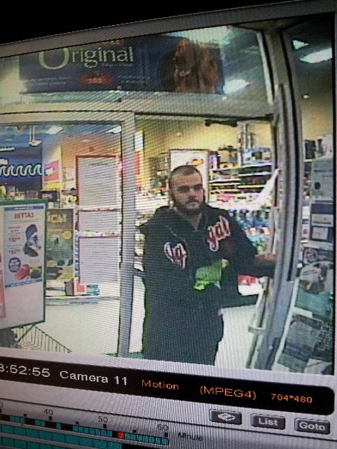 A picture was posted online by the store showing the alleged thief with the parrot that is believed to be stolen in his hand.