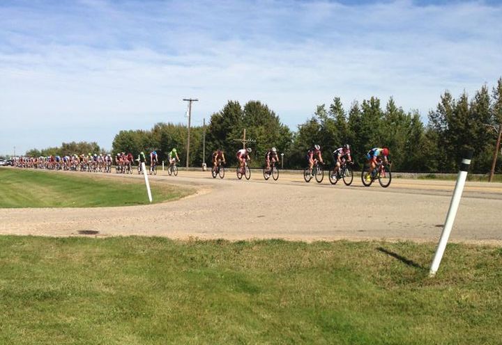Cyclists participating in the Tour of Alberta make their way through the province, south of Millet.
