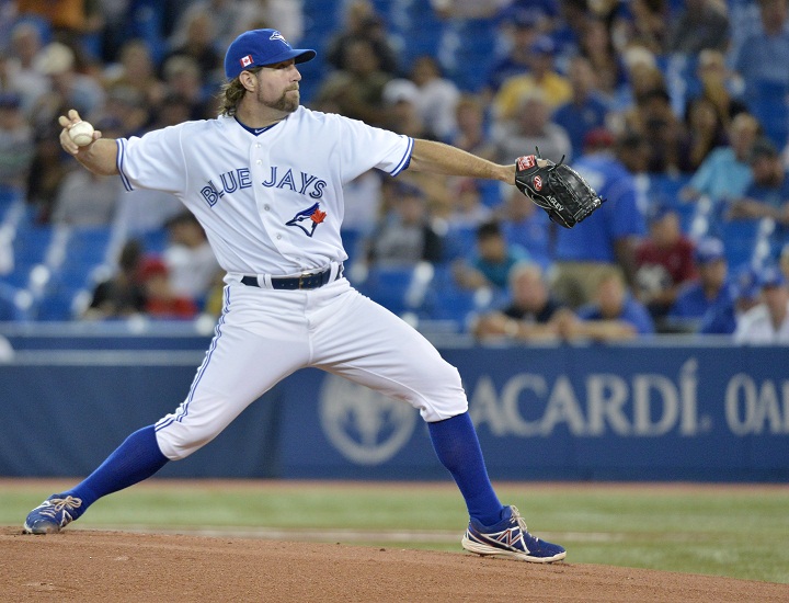 Toronto Blue Jays starting pitcher R.A. Dickey throws against the Los Angeles Angels during first inning AL baseball action in Toronto on Wednesday, Sept. 11, 2013. 
