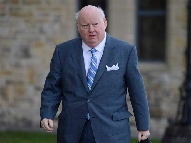Sen. Mike Duffy arrives to the Senate on Parliament Hill in Ottawa, Monday, October 28, 2013.