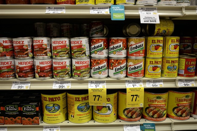 Salsas and other items are seen in the International food aisle of a grocery store.