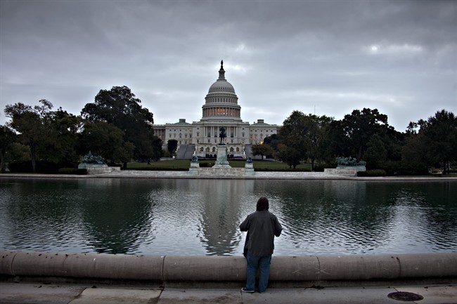 Cloudy skies shroud the Capitol in Washington, Monday morning, Oct. 14, 2013.