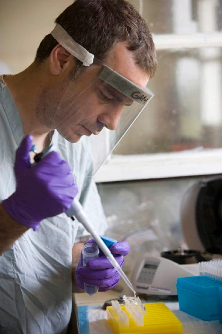Gary Kobinger works in a mobile laboratory installed by specialists of the National Public Health Agency of Canada, in Mweka, Congo, Friday, Sept. 28, 2007. Scientists at Canada's National Microbiology Laboratory are continuing to fine-tune a possible treatment for Ebola virus infection, one of the deadliest known to humankind.