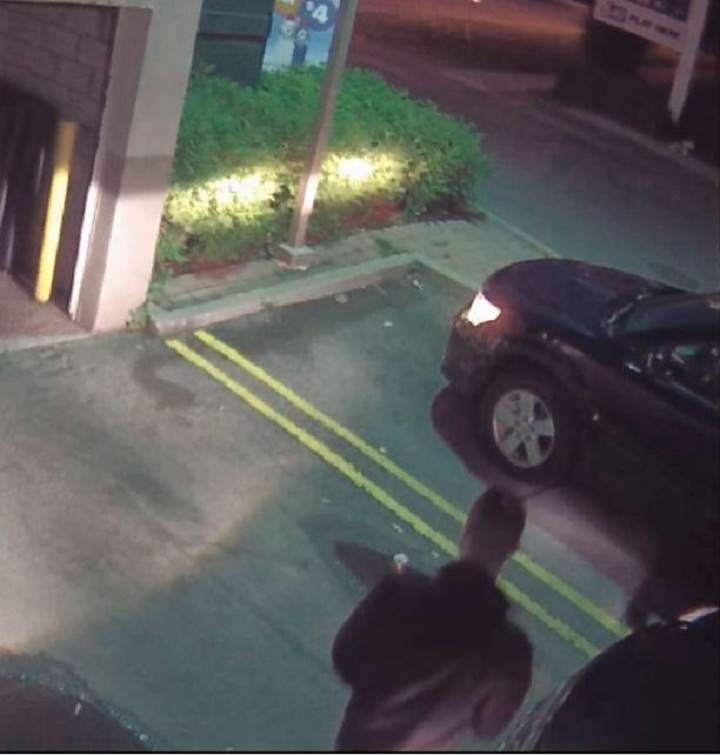 Police surveillance of Ford and Lisi with packages at a Scarlett Road gas station - image