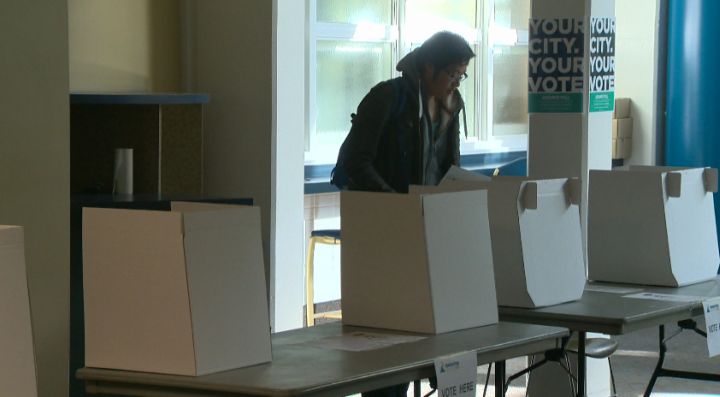 A NAIT student casts his ballot at an advance polling station Tuesday, October 15, 2013.