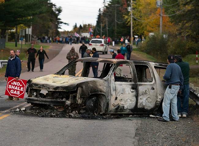 A police vehicle is seen in Rexton, N.B. as police began enforcing an injunction to end an ongoing demonstration against shale gas exploration in eastern New Brunswick on Oct.17, 2013.