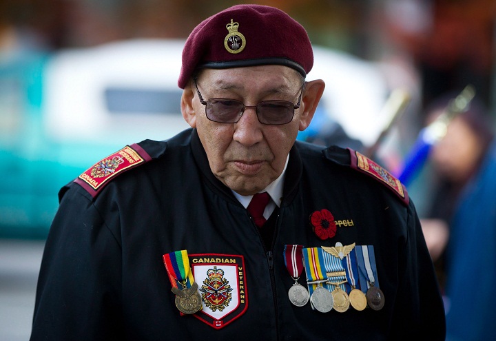 Korean War veteran Allen Derouin, 77, of the Ojibwe First Nation in Hudson, Ont., who served with the 2nd Battalion, Princess Patricia’s Canadian Light Infantry, attends a National Aboriginal Veterans Day ceremony at the Victory Square Cenotaph in Vancouver, B.C., on Friday November 8, 2013. (The Canadian Press/Darryl Dyckber)