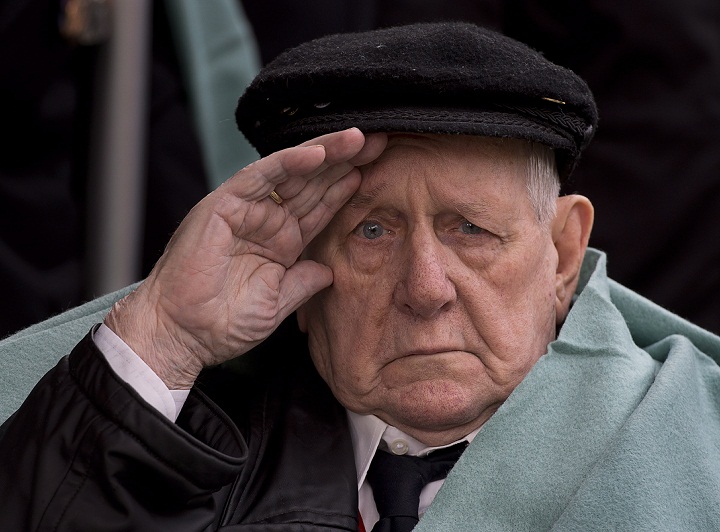 Allan Tanner, 88, salutes at the Remembrance Day ceremonies at the Grande Parade in Halifax on Monday, Nov. 11, 2013. (The Canadian Press/Andrew Vaughan)