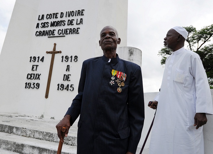 Ivorian World War II veterans pose in front of a monument in memory of WWI and WWII soldiers on November 11, 2013 in Abidjan during the Armistice Day ceremonies marking the end of World War I. (Sia Kambou/Getty Images)