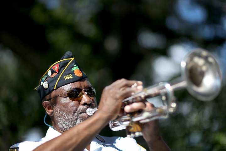 Cyril Bullard retired from the United States Army plays the trumpet during a Veterans Day ceremony at the Coconut Grove Bahamian cemetery on November 11, 2013 in Coconut Grove, Florida. (Joe Raedle/Getty Images)