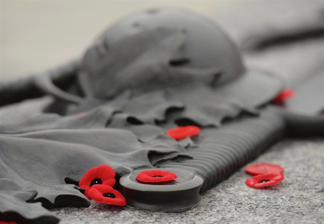 Poppies lie on the Tomb of the Unknown Soldier at the National War memorial.